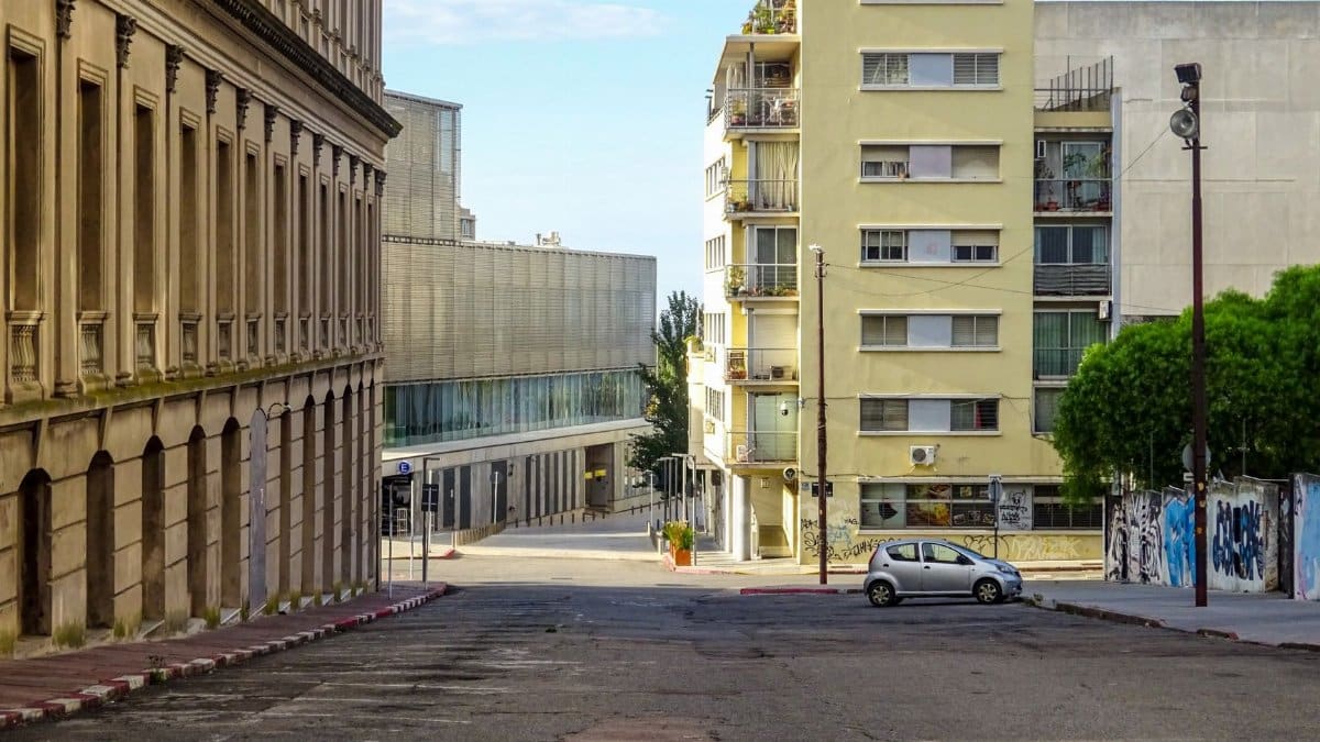 View of a quiet street with mixed architecture in Montevideo, Uruguay.