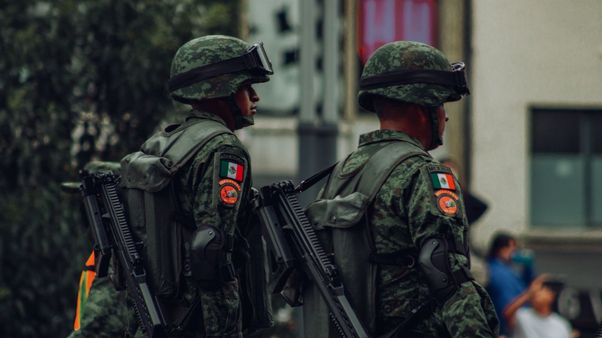 Two Mexican soldiers in camouflage uniforms on duty, Mexico City.