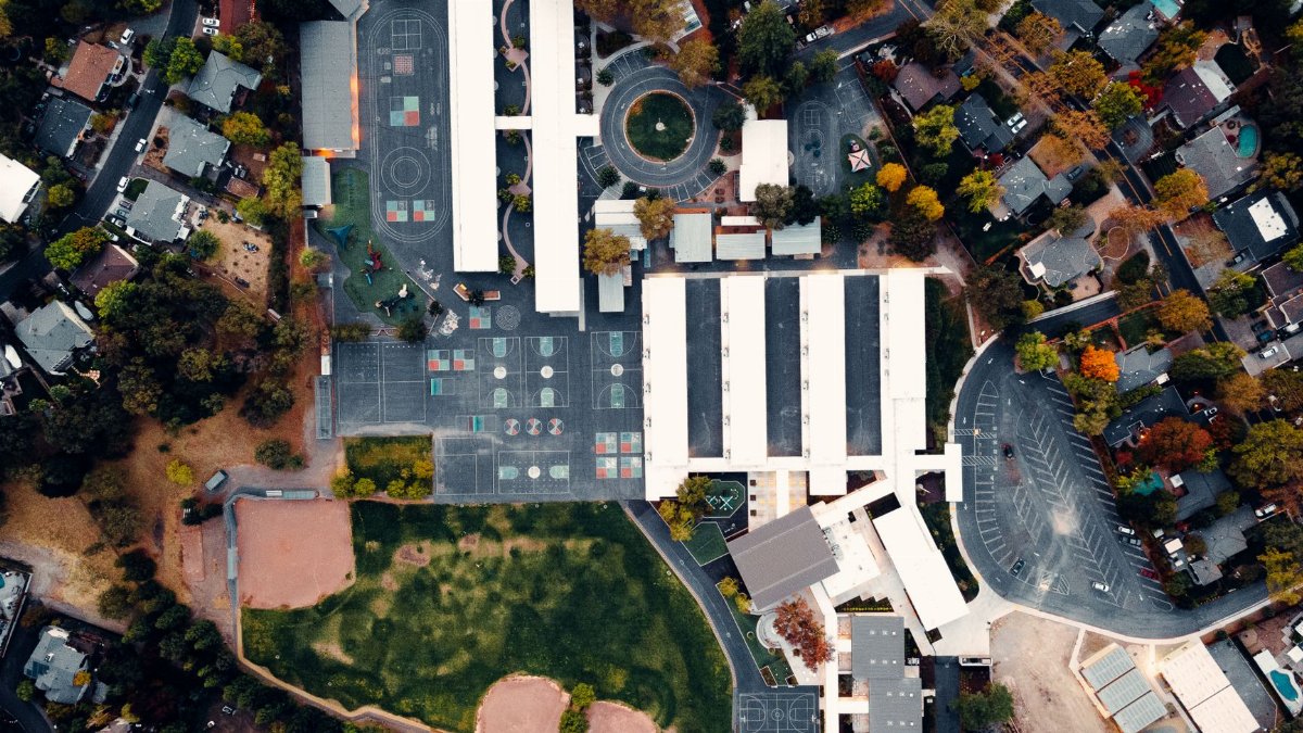 Aerial view of Walnut Creek residential area and school, capturing urban and suburban elements.