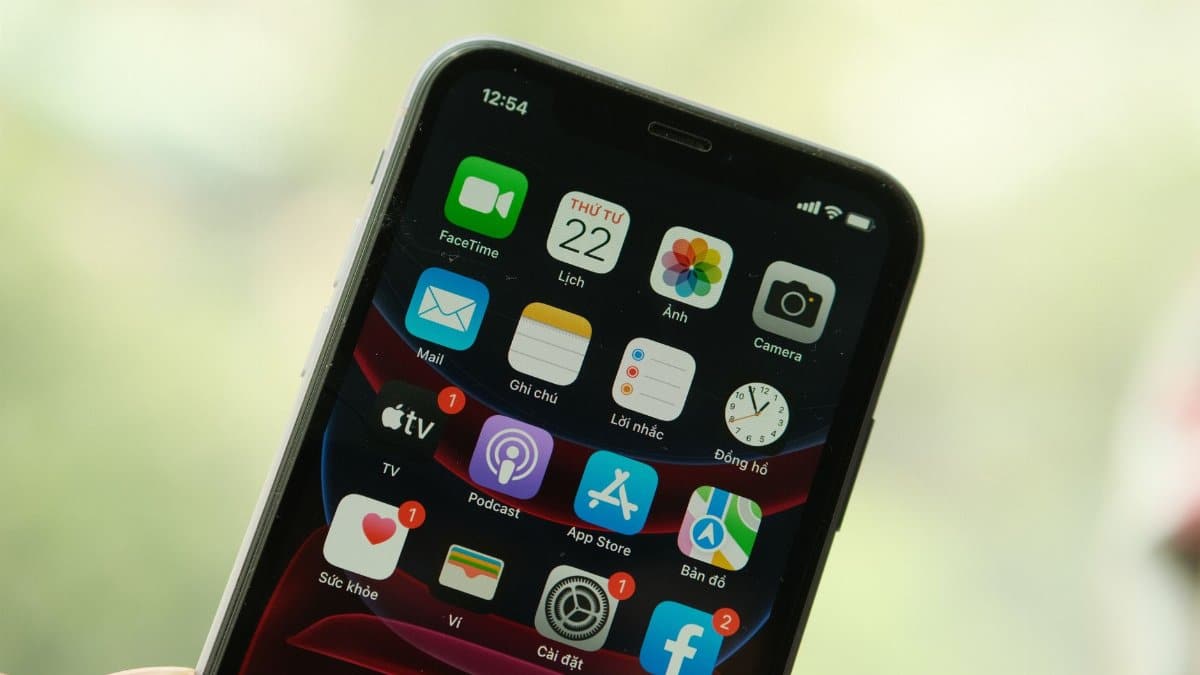 Close-up view of a smartphone screen displaying various apps and notifications.