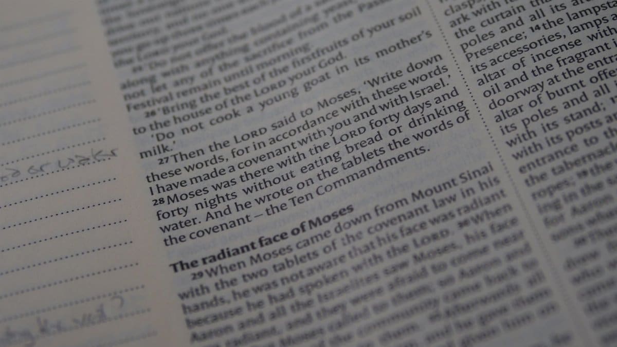 A detailed view of a Bible page focusing on Exodus scripture text.