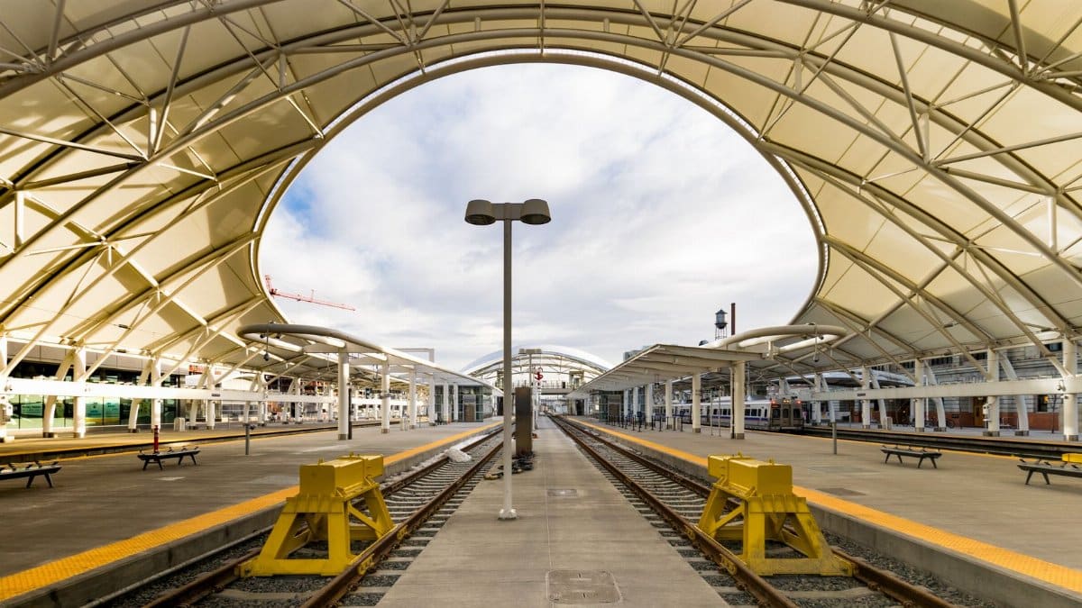A sunny day at the Denver train station showcasing modern structural design.