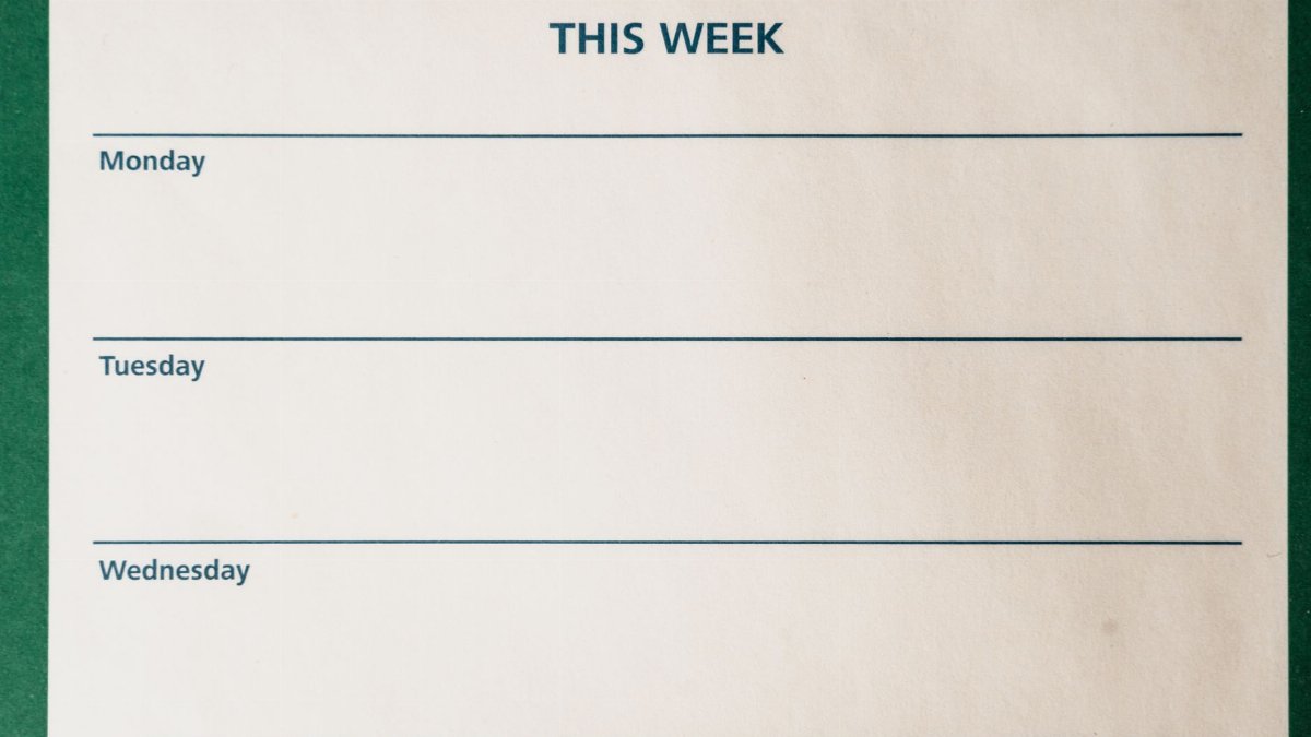Minimalist blank weekly planner with days for scheduling and organizing tasks.