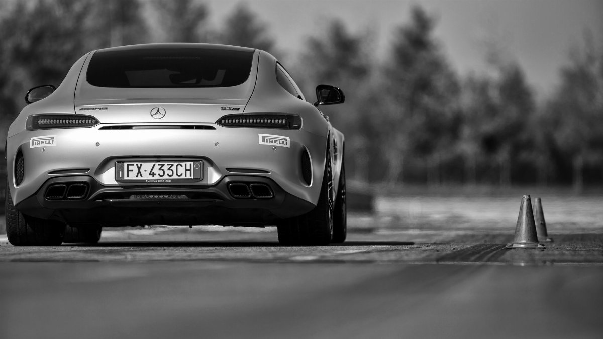 High-performance sports car positioned for track action, emphasizing speed and precision.