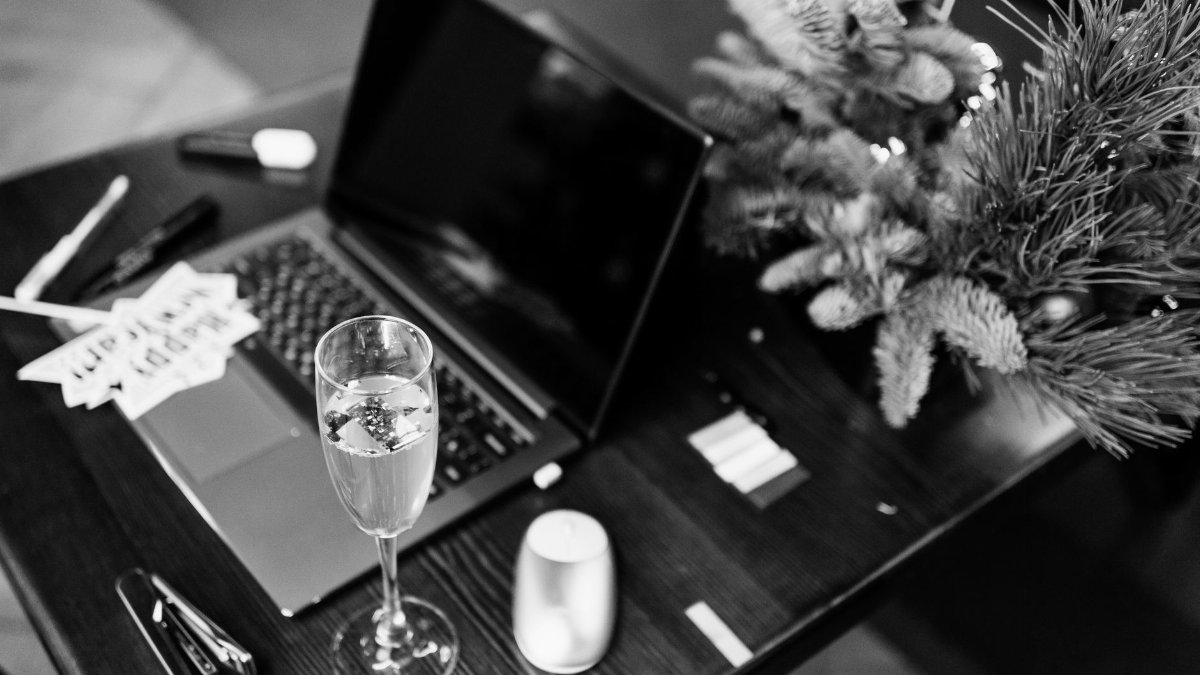 Elegant office celebration scene with champagne and holiday decorations.