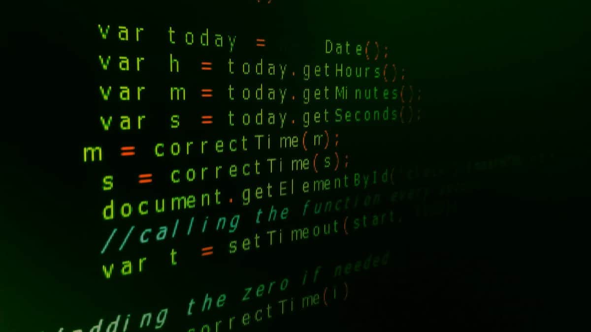Close-up of JavaScript code on a computer screen with green text highlighting syntax.