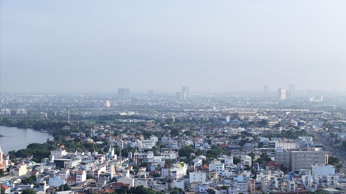 Expansive view of Ho Chi Minh City skyline showcasing urban landscape under a clear sky.