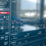 Close-up of a digital screen displaying stock trading graphs and cryptocurrency values. Ideal for finance and technology themes.