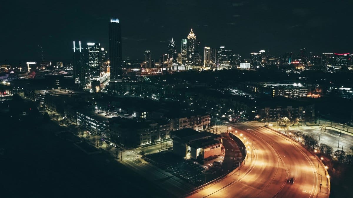 Stunning nighttime aerial view of Atlanta's cityscape with illuminated skyscrapers.