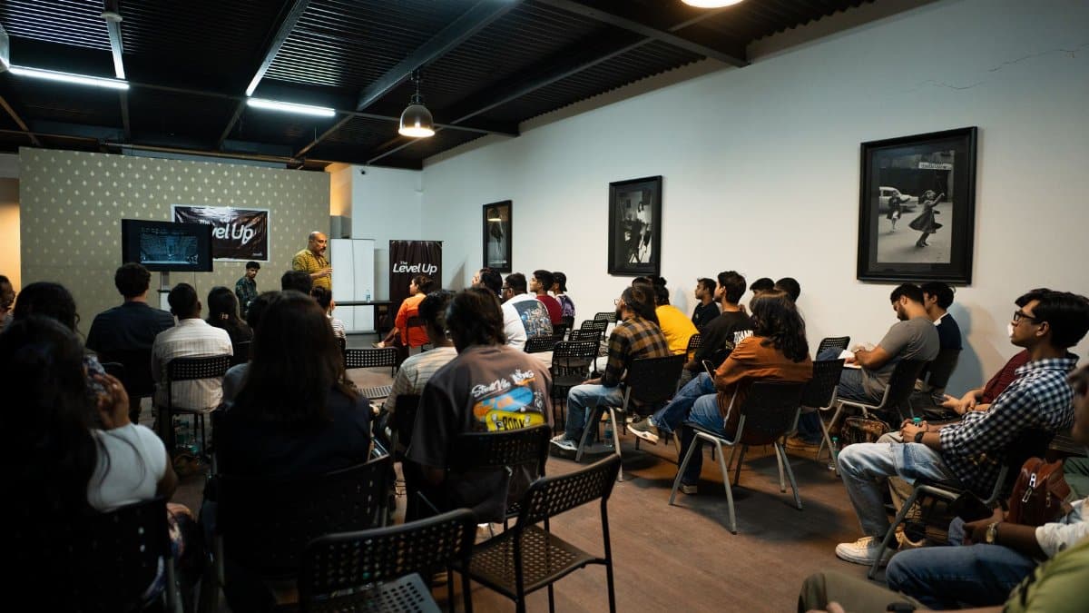 Participants attend a workshop presentation indoors with engaging visuals and discussions.