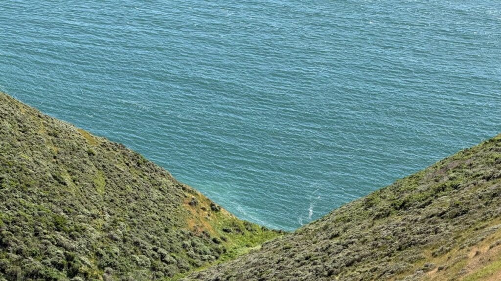 Breathtaking view of coastal cliffs and the blue ocean in California, USA.