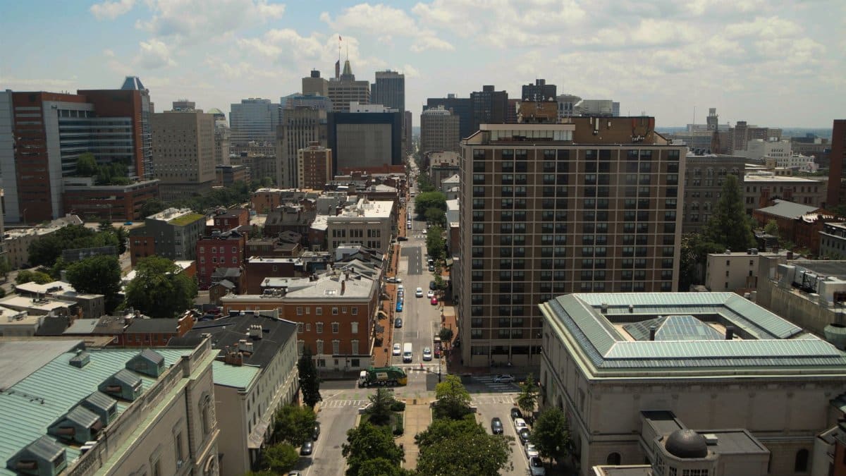 Panoramic aerial view of downtown Baltimore's skyline featuring skyscrapers and residential buildings.