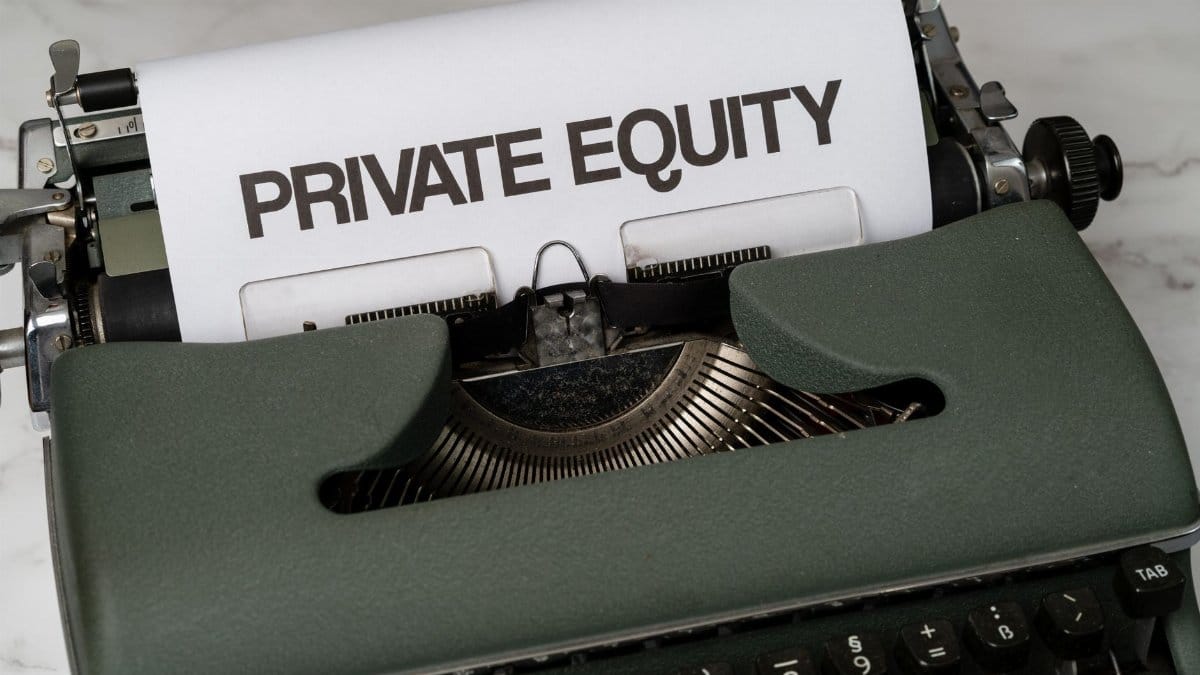 Close-up of vintage typewriter with 'PRIVATE EQUITY' on paper, business concept.