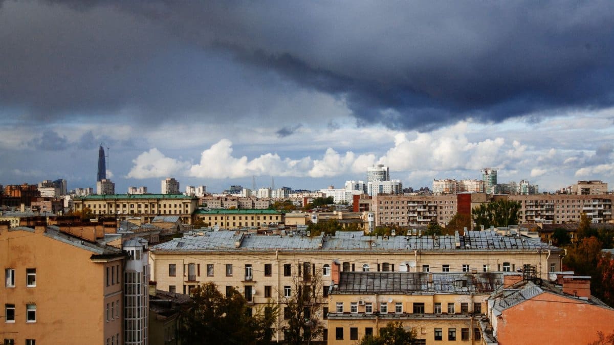 From above of cityscape with typical residential buildings in different styles on overcast weather located in Saint Petersburg Russia