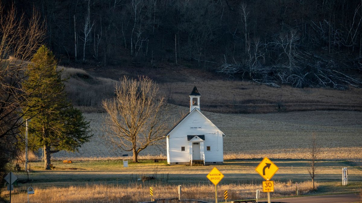 Scenic view of a quaint church surrounded by fields in Ella, Wisconsin, USA.