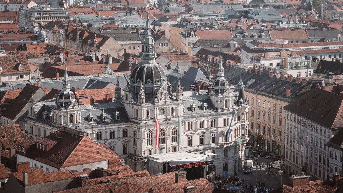 Captivating aerial view of Graz City Hall with surrounding red rooftops, Styria, Austria.