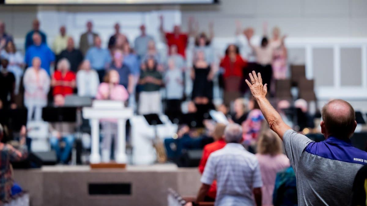 A church congregation participates in a worship service with a focus on community and spirituality.