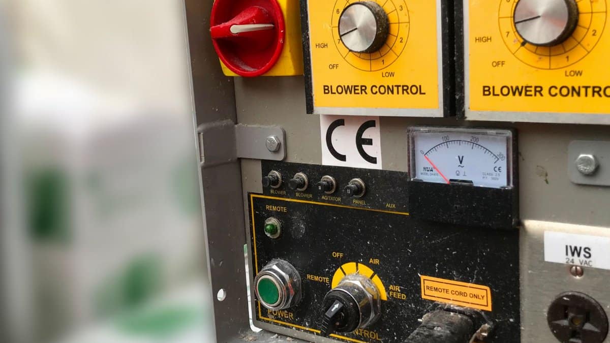 Detailed view of an industrial control panel with blower controls and meters in Crowthorne.