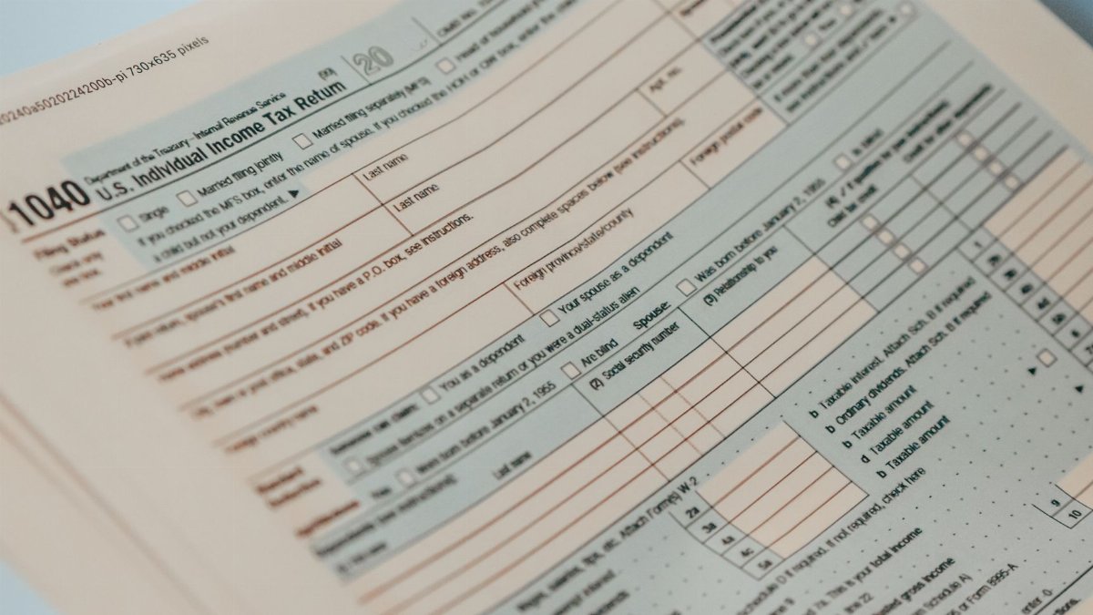 Detailed close-up image of a U.S. 1040 Individual Income Tax Return form, ideal for finance-related content.