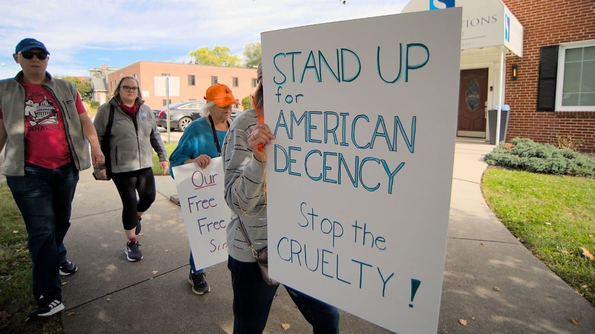 A peaceful protest in Towson, Maryland advocating for American decency and against cruelty.