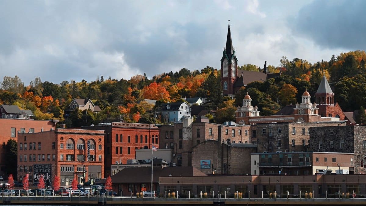 Charming downtown Duluth with fall foliage and historic buildings along the lakeshore.