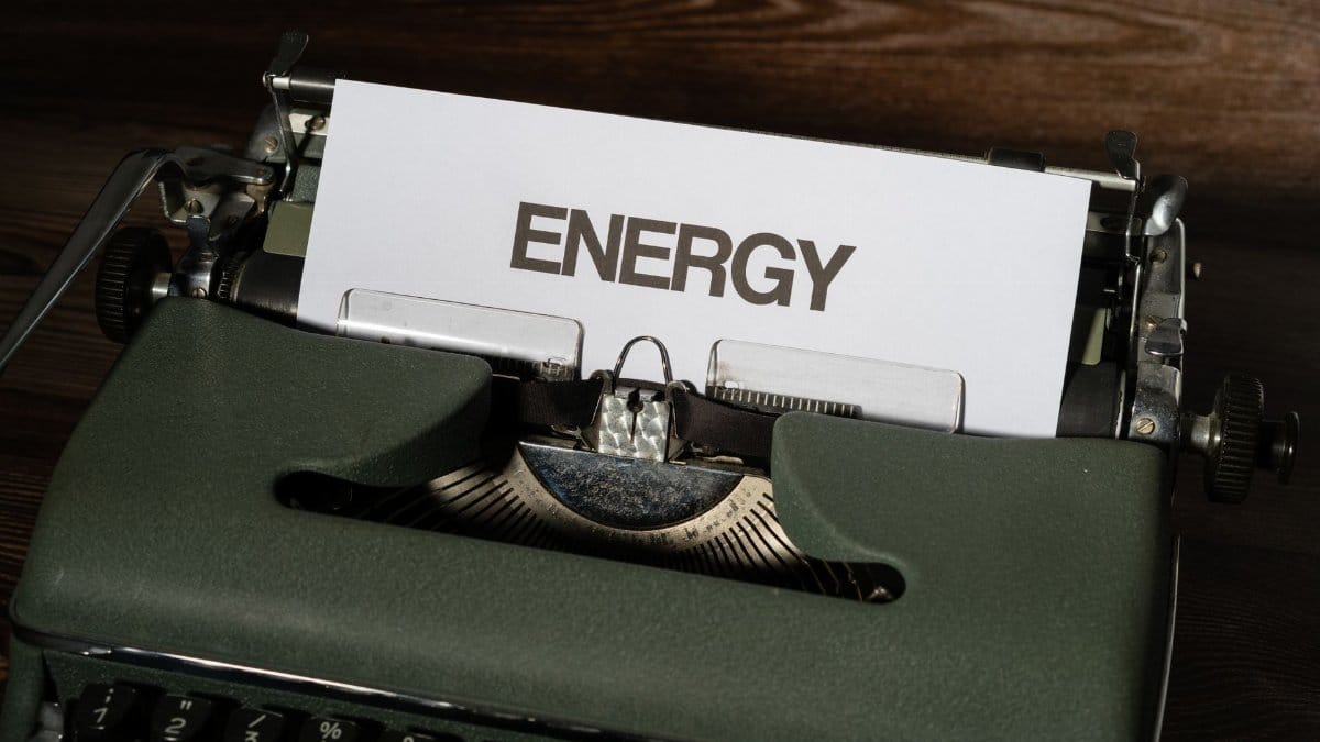 Close-up of a vintage typewriter with the word 'ENERGY' on paper, evoking nostalgia.