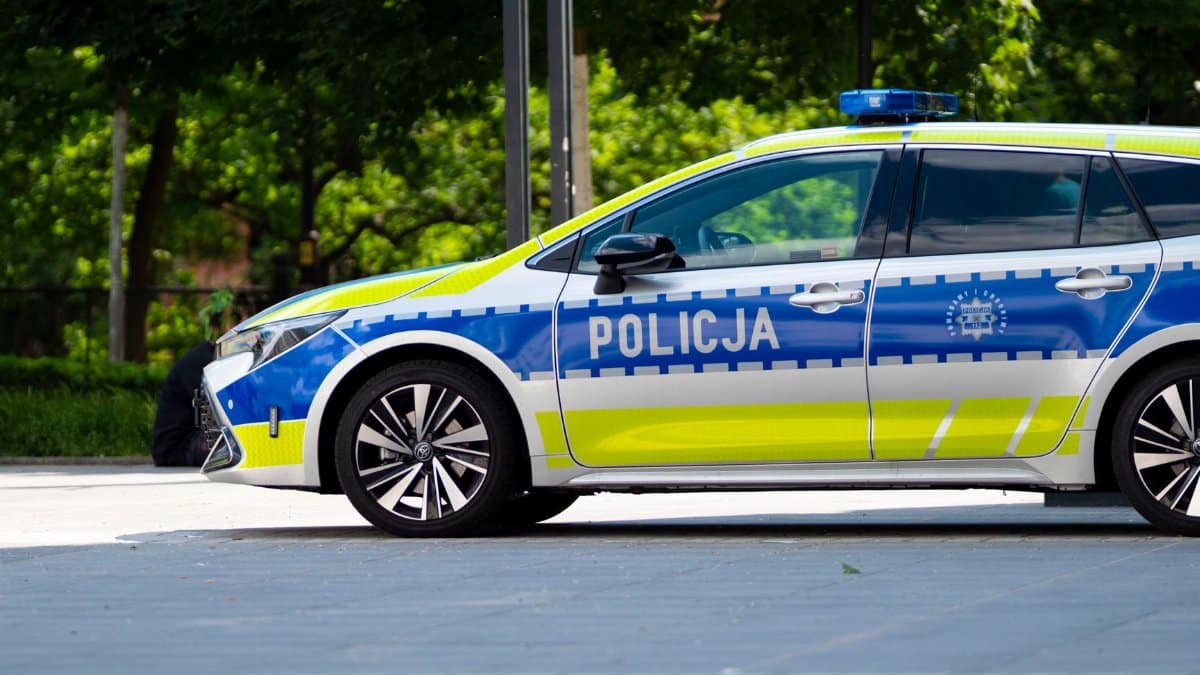 Polish police car parked outdoors in Wrocław, Poland, showcasing European law enforcement vehicle design.
