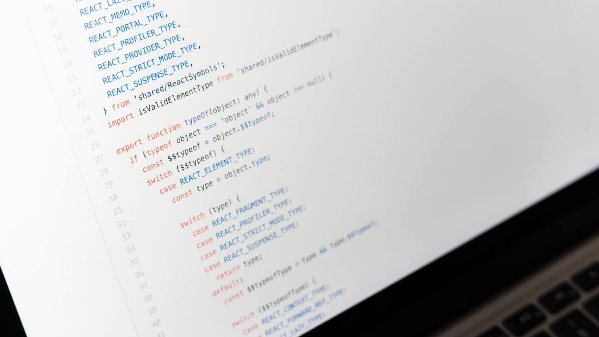 Close-up of JavaScript code on a laptop screen, showcasing programming in progress.