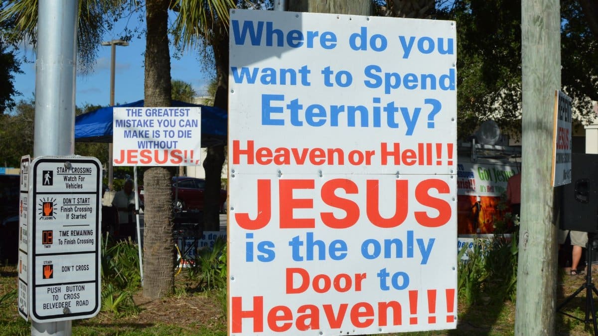A bold outdoor sign displaying a Christian message about eternity and faith in Jesus.