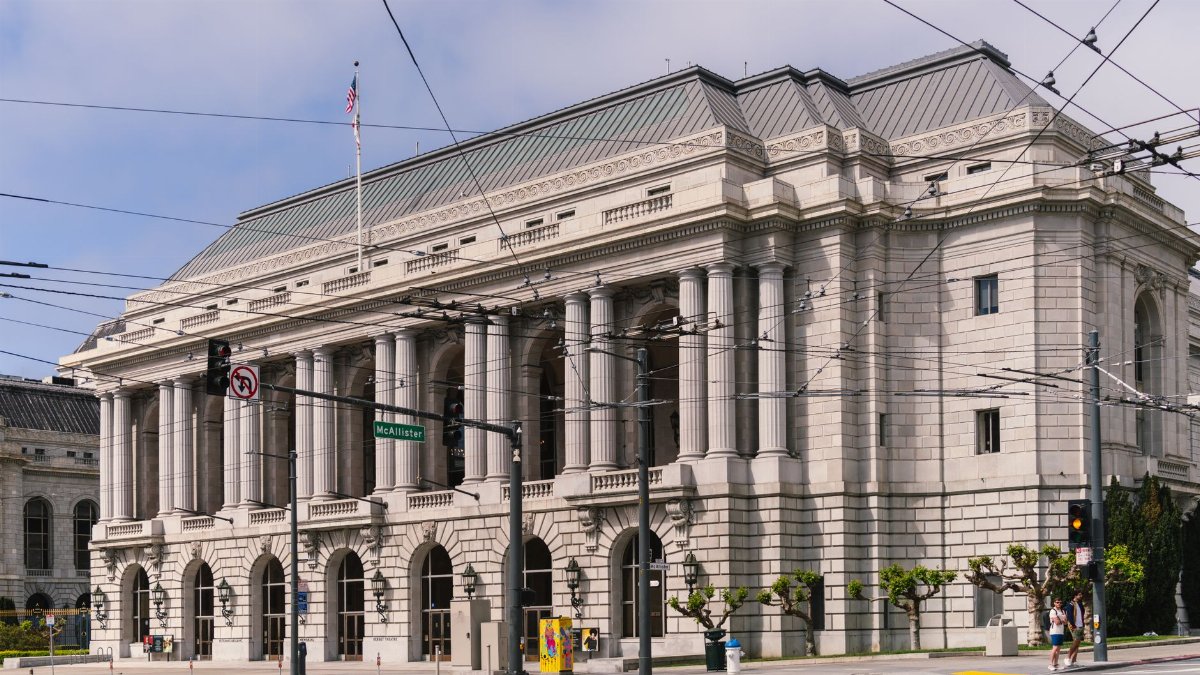 Classical-style building with columns in a cityscape setting, perfect for architecture stock imagery.