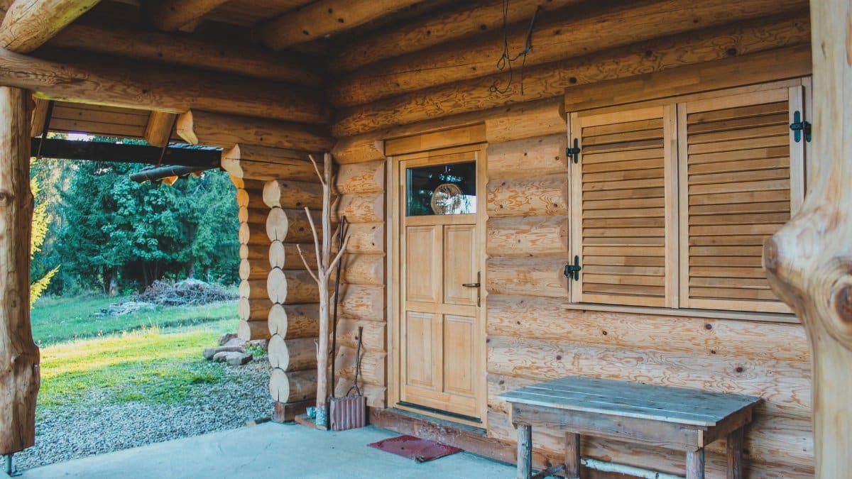 Charming wooden cabin exterior with natural texture surrounded by nature in HR, Romania.