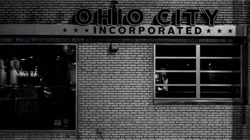 Black and white image of Ohio City's famous building façade at night highlighting urban architecture.