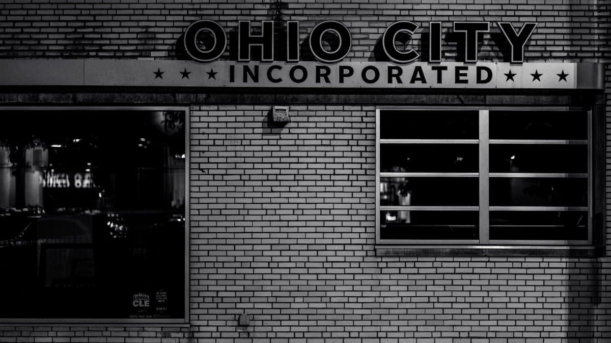 Black and white image of Ohio City's famous building façade at night highlighting urban architecture.