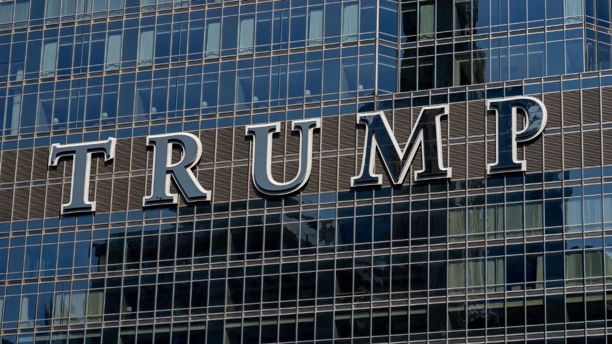 Detailed facade view of the Trump building with reflective glass windows.