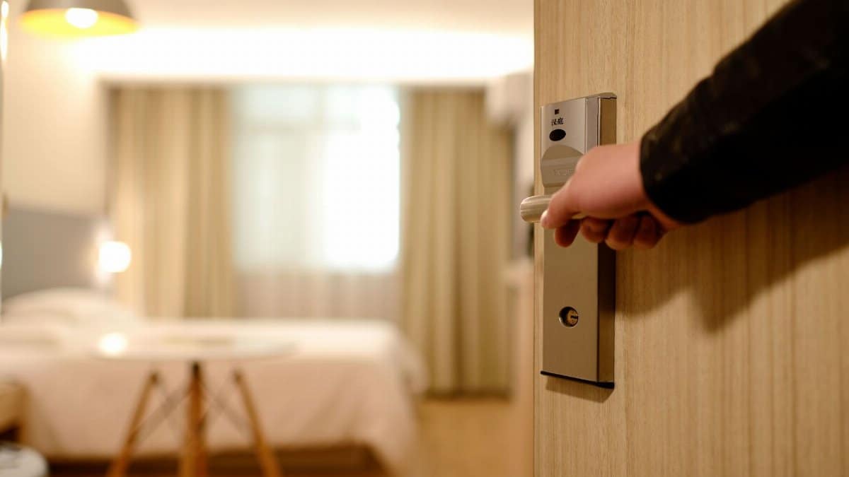 A soft-lit hotel room entrance, welcoming guests with luxury appeal and comfort.
