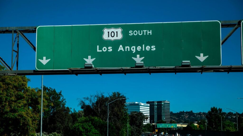 Scenic view of the Highway 101 South sign directing toward Los Angeles with traffic below.