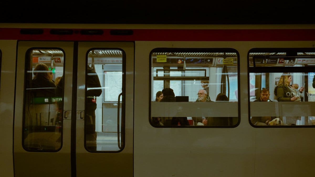 Passengers commuting on a subway in Lyon, France, captured in a candid shot.