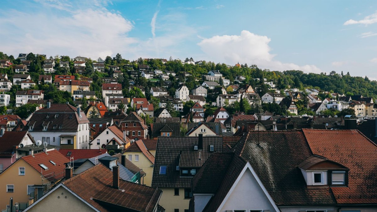 Charming hillside neighborhood view in Stuttgart, showcasing vibrant rooftops and lush greenery.