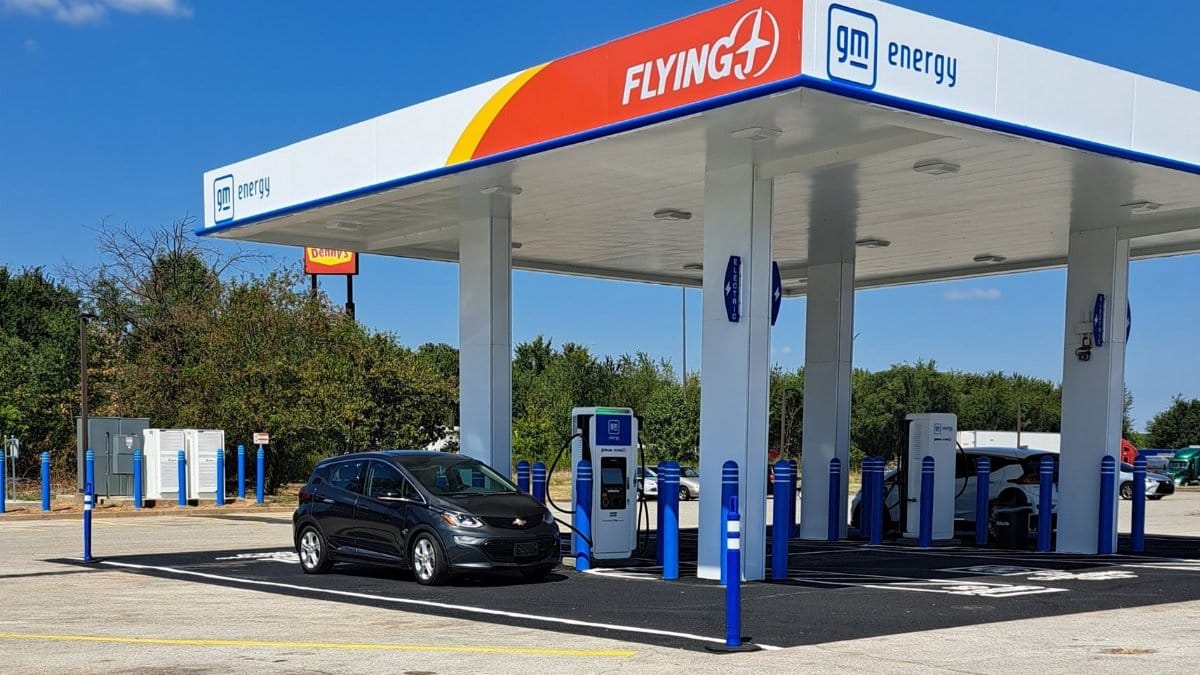 A Chevrolet Bolt EV charging at a GM Energy station in Franklin, Kentucky on a sunny day.