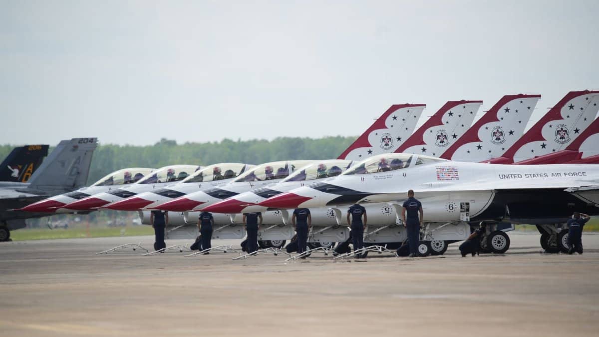 F-16 Thunderbirds lined up for an air show in Hampton, Virginia, showcasing precision and skill.