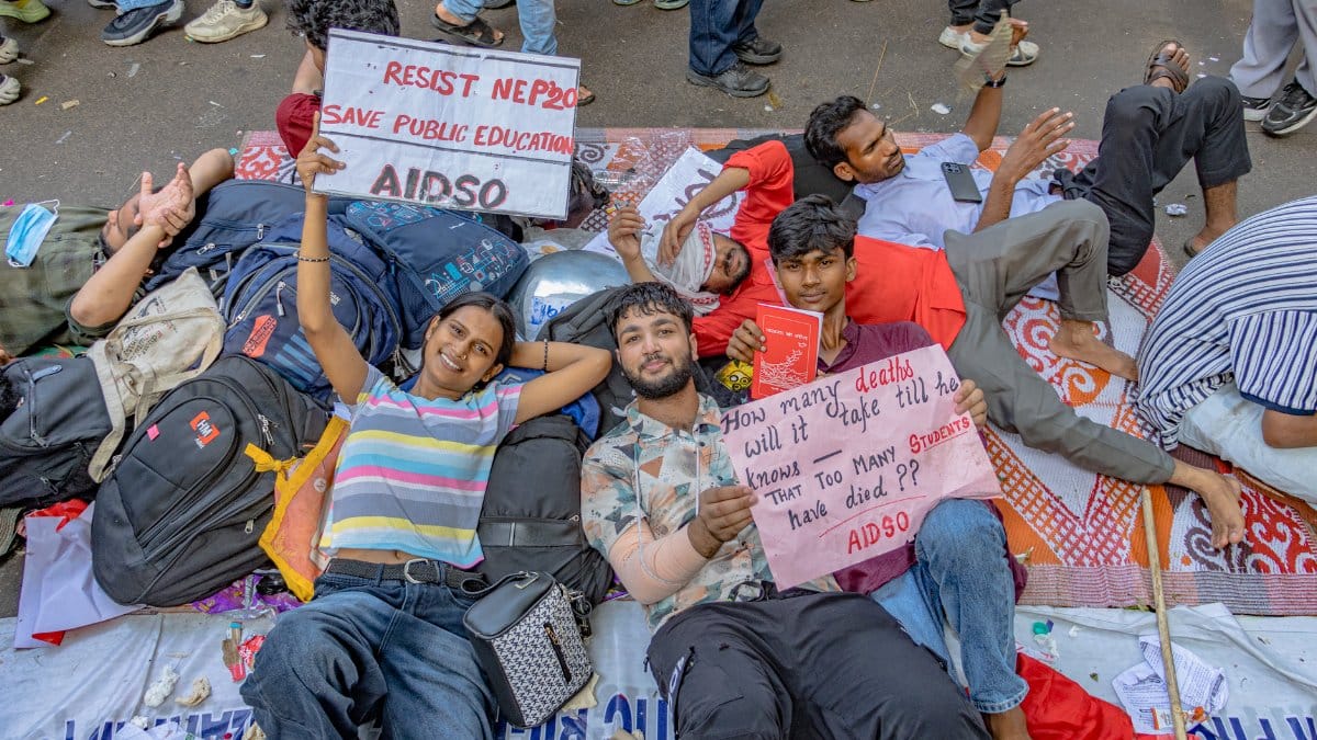 Students at a peaceful protest in New Delhi, advocating for public education rights.