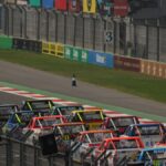Dynamic truck race at Mexico City's famous Autódromo Hermanos Rodríguez track.