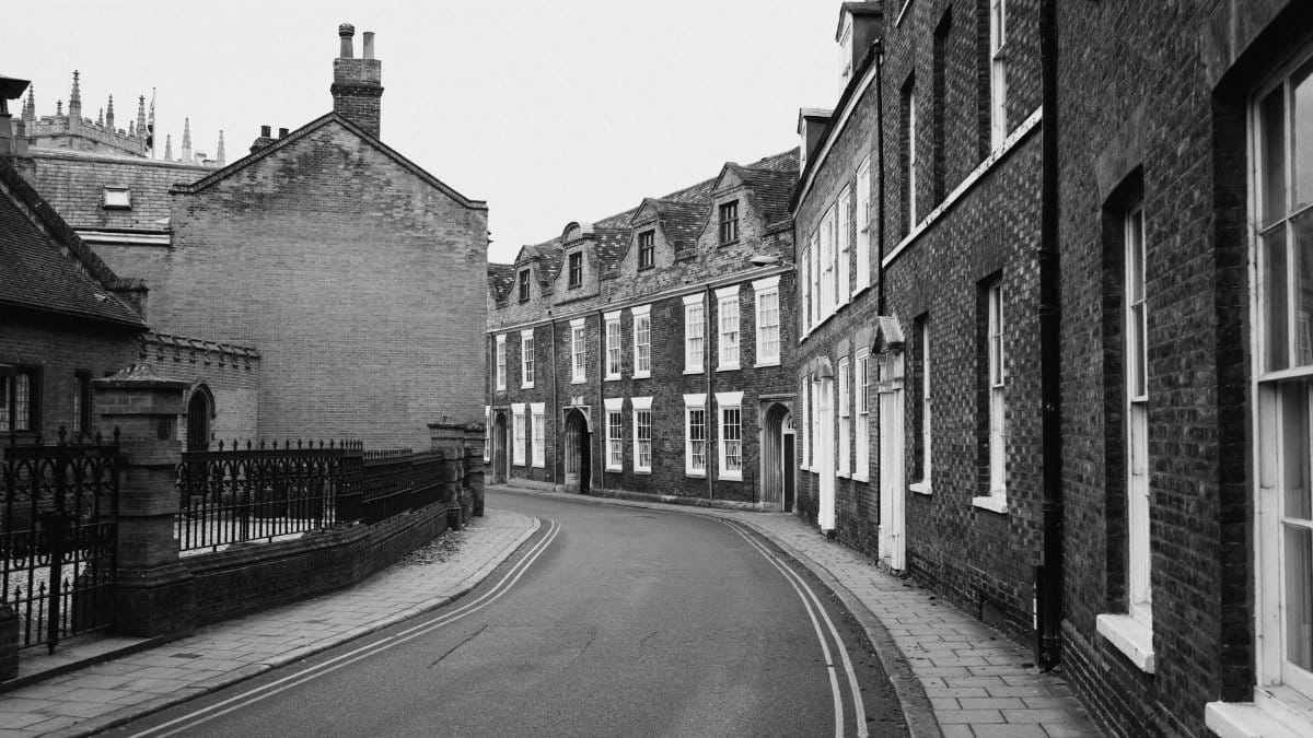 Black and white photo of a historic street in King's Lynn, showcasing classic architecture.
