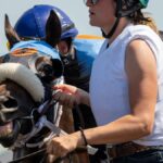 Dynamic close-up of a horse race with a jockey in Shakopee, capturing the thrill and intensity of the competition.