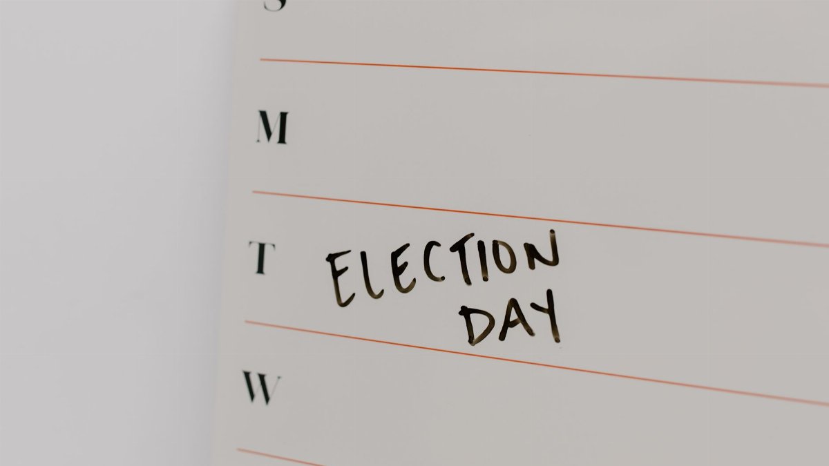 Close-up of a planner with 'Election Day' noted on Tuesday. Perfect for political event reminders.