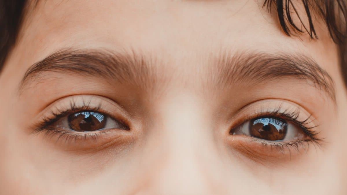 A high-definition close-up focusing on a child's eyes, capturing detail and emotion.