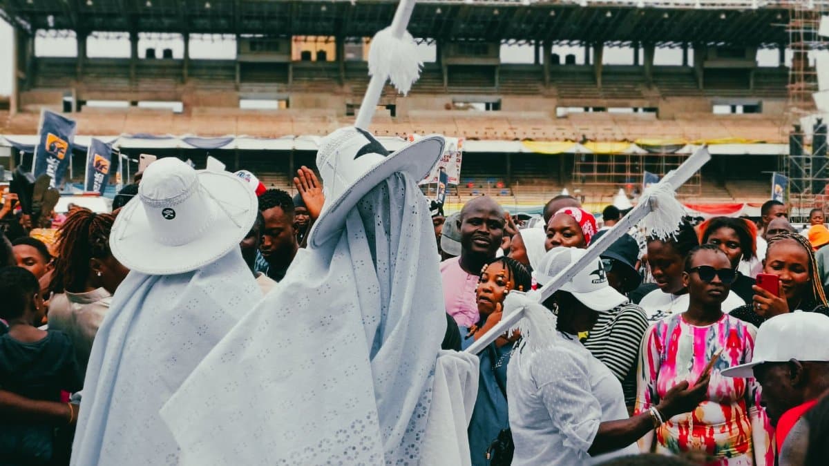 Cultural festival in Lagos, Nigeria with people in traditional attire and crowds celebrating.