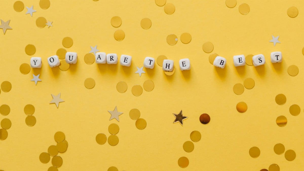 Inspirational message 'You Are The Best' with confetti on a yellow background.