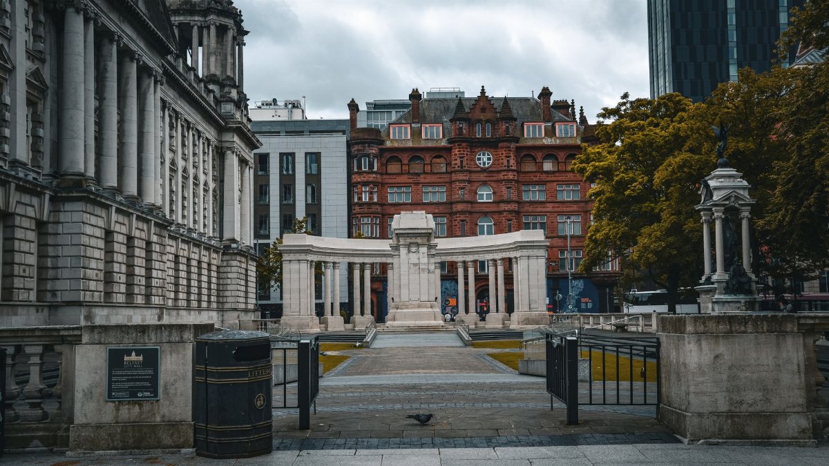 Historic architecture in Manchester with classical columns and red-bricked buildings.