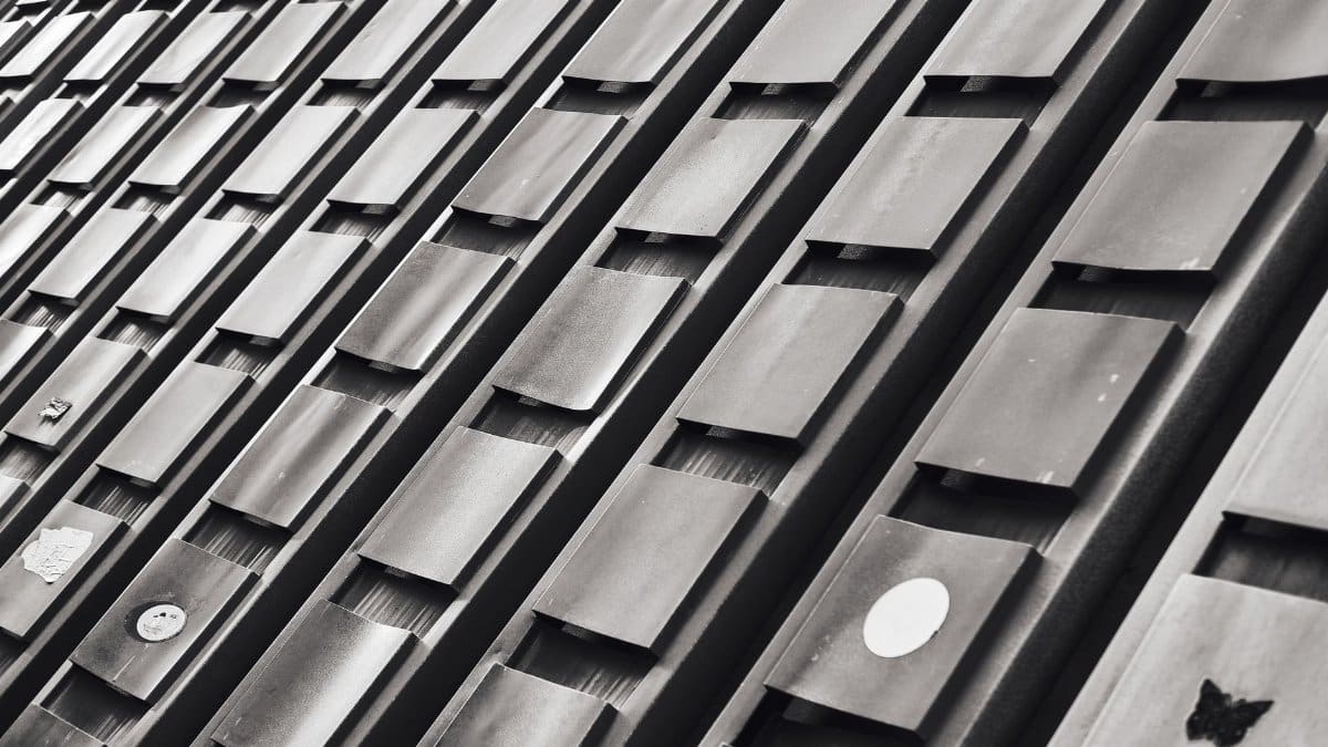 Close-up of a modern building facade with geometric patterns in black and white.